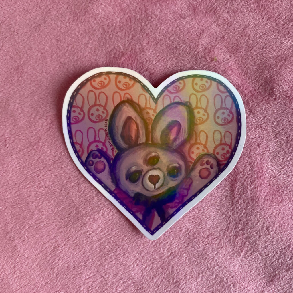Nini 💜 | Sticker Holográfico Conejita de Tres Ojos